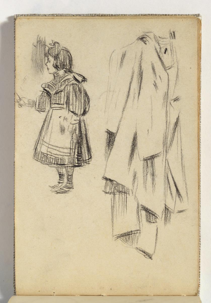 Niña con delantal y abrigo colgado