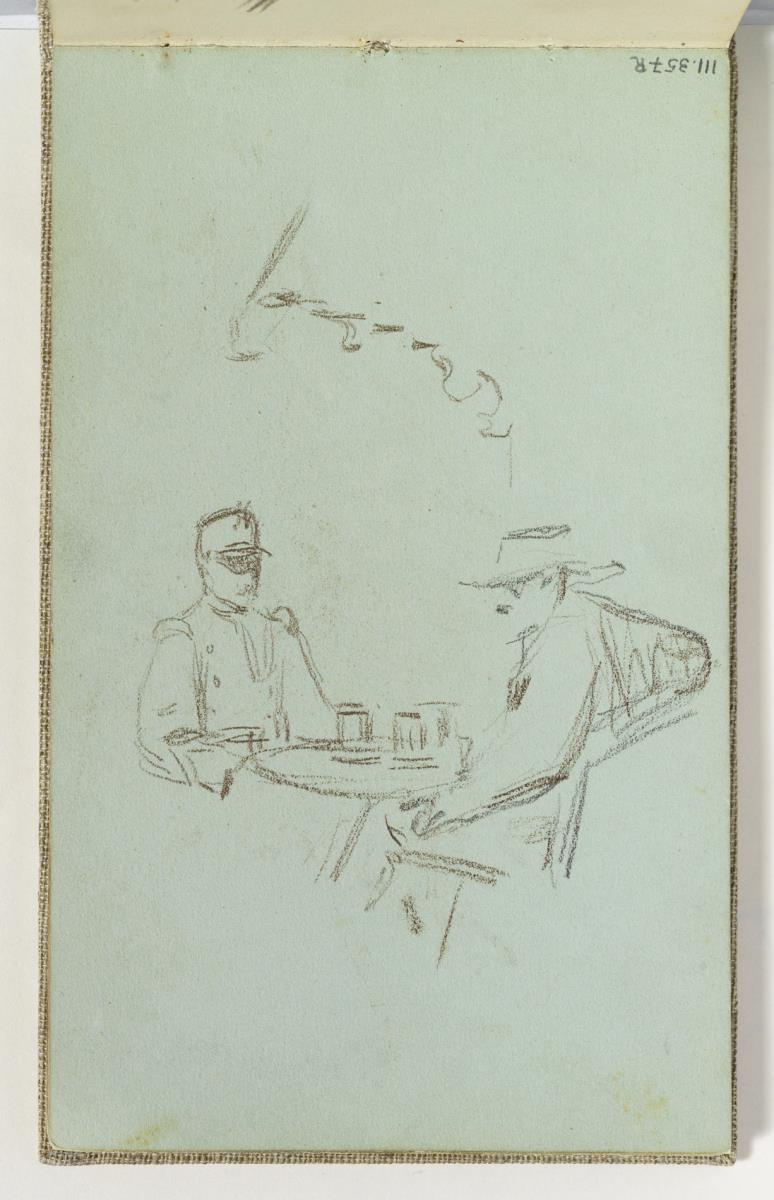 Homes asseguts en un cafè