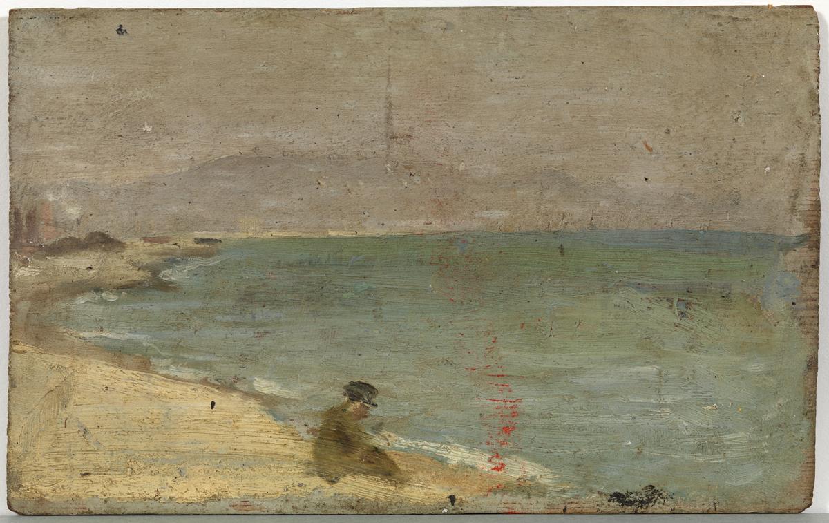 Hombre sentado en la playa de la Barceloneta