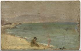Hombre sentado en la playa de la Barceloneta
