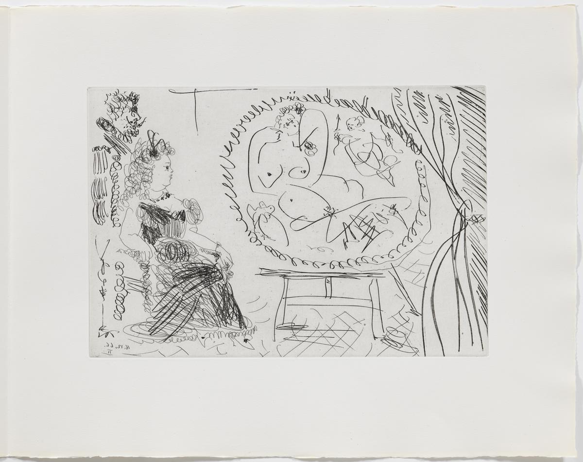 Parella de diletants mirant un quadre