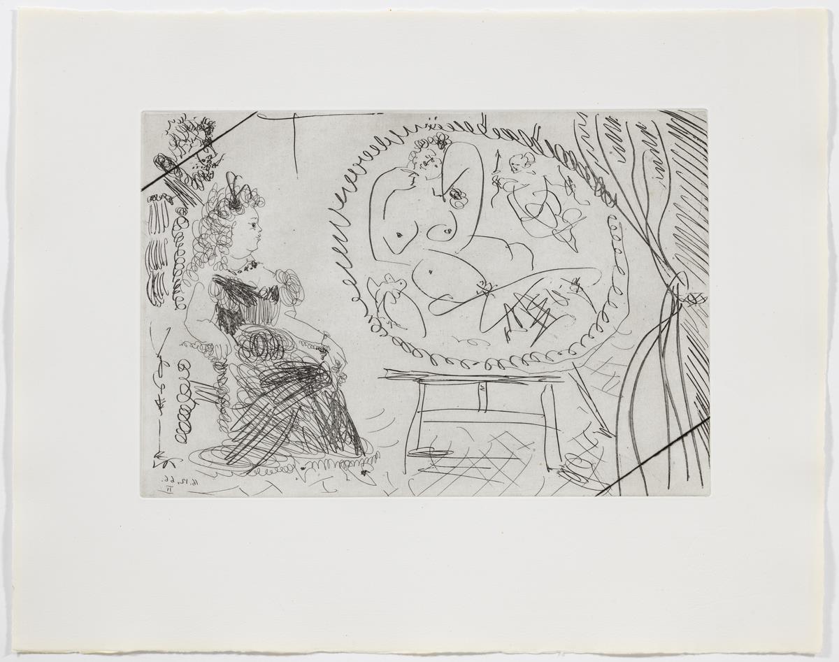 Parella de diletants mirant un quadre